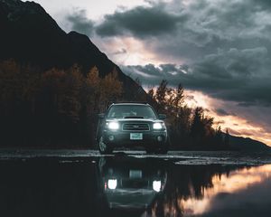 Preview wallpaper car, suv, black, water, reflection