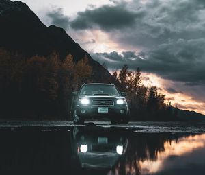 Preview wallpaper car, suv, black, water, reflection