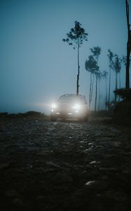 Preview wallpaper car, suv, fog, light, twilight