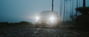 Preview wallpaper car, suv, fog, light, twilight