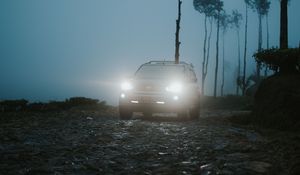 Preview wallpaper car, suv, fog, light, twilight