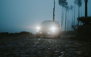Preview wallpaper car, suv, fog, light, twilight