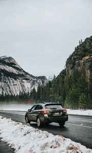 Preview wallpaper car, suv, gray, road, mountains, snow