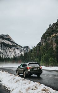 Preview wallpaper car, suv, gray, road, mountains, snow