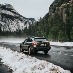 Preview wallpaper car, suv, gray, road, mountains, snow