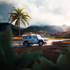 Preview wallpaper car, suv, palm tree, mountains