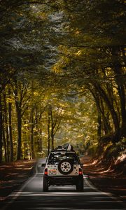 Preview wallpaper car, suv, road, forest, travel