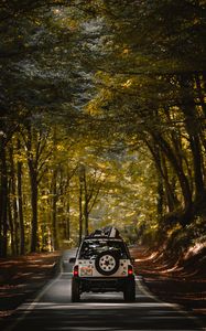 Preview wallpaper car, suv, road, forest, travel