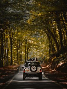 Preview wallpaper car, suv, road, forest, travel