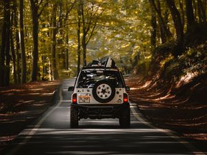 Preview wallpaper car, suv, road, forest, travel