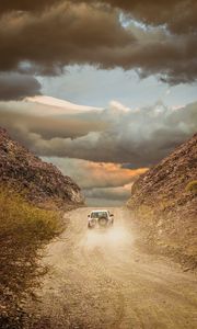 Preview wallpaper car, suv, road, dust, sky