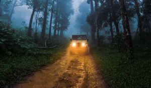 Preview wallpaper car, suv, road, forest, fog