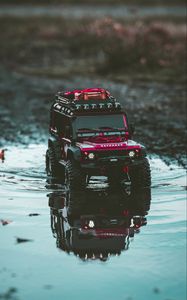 Preview wallpaper car, suv, toy, red, puddle