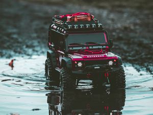 Preview wallpaper car, suv, toy, red, puddle