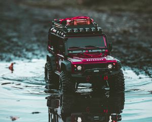 Preview wallpaper car, suv, toy, red, puddle