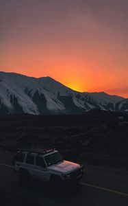 Preview wallpaper car, suv, white, sunset, mountains, road