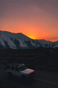Preview wallpaper car, suv, white, sunset, mountains, road