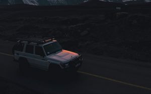 Preview wallpaper car, suv, white, sunset, mountains, road