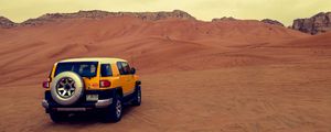 Preview wallpaper car, suv, yellow, desert, sand