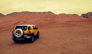 Preview wallpaper car, suv, yellow, desert, sand