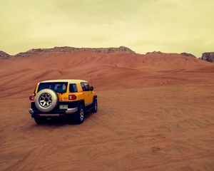 Preview wallpaper car, suv, yellow, desert, sand