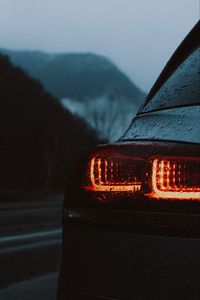 Preview wallpaper car, taillights, wet, red, dark