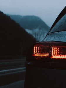 Preview wallpaper car, taillights, wet, red, dark