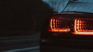 Preview wallpaper car, taillights, wet, red, dark