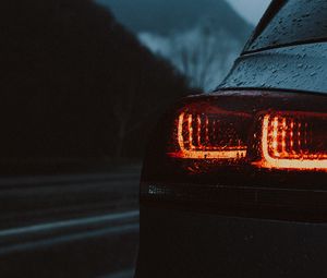 Preview wallpaper car, taillights, wet, red, dark