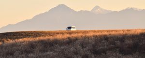 Preview wallpaper car, van, white, field, mountains, landscape