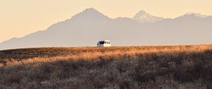 Preview wallpaper car, van, white, field, mountains, landscape