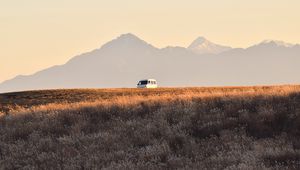 Preview wallpaper car, van, white, field, mountains, landscape