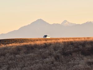 Preview wallpaper car, van, white, field, mountains, landscape