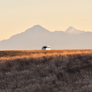 Preview wallpaper car, van, white, field, mountains, landscape