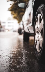 Preview wallpaper car, wheel, puddle, rain, drops
