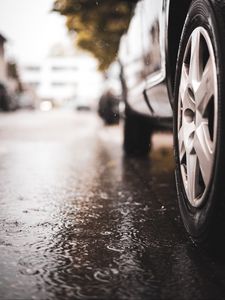Preview wallpaper car, wheel, puddle, rain, drops