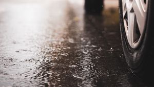 Preview wallpaper car, wheel, puddle, rain, drops