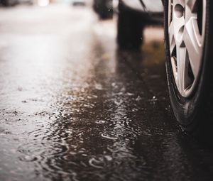 Preview wallpaper car, wheel, puddle, rain, drops