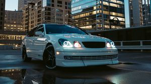 Preview wallpaper car, white, city, buildings