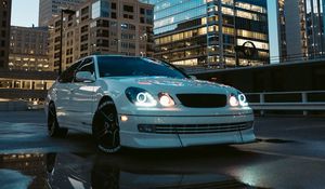 Preview wallpaper car, white, city, buildings