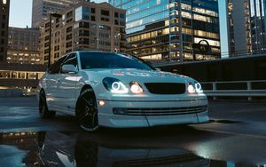 Preview wallpaper car, white, city, buildings