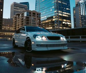 Preview wallpaper car, white, city, buildings