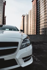 Preview wallpaper car, white, front view, buildings