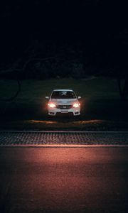 Preview wallpaper car, white, light, headlights, front view, dark