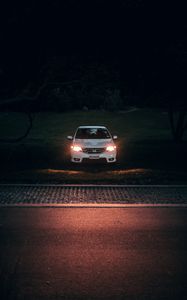 Preview wallpaper car, white, light, headlights, front view, dark