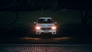 Preview wallpaper car, white, light, headlights, front view, dark