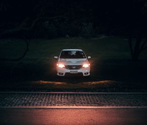 Preview wallpaper car, white, light, headlights, front view, dark