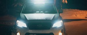 Preview wallpaper car, white, lights, light, snow, winter