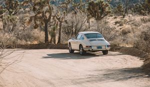 Preview wallpaper car, white, retro, road, cacti