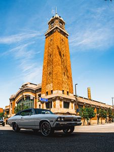 Preview wallpaper car, white, retro, tower, road